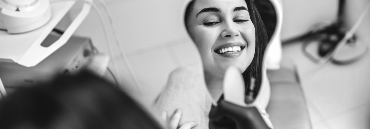 Woman Smiling in Dental Office